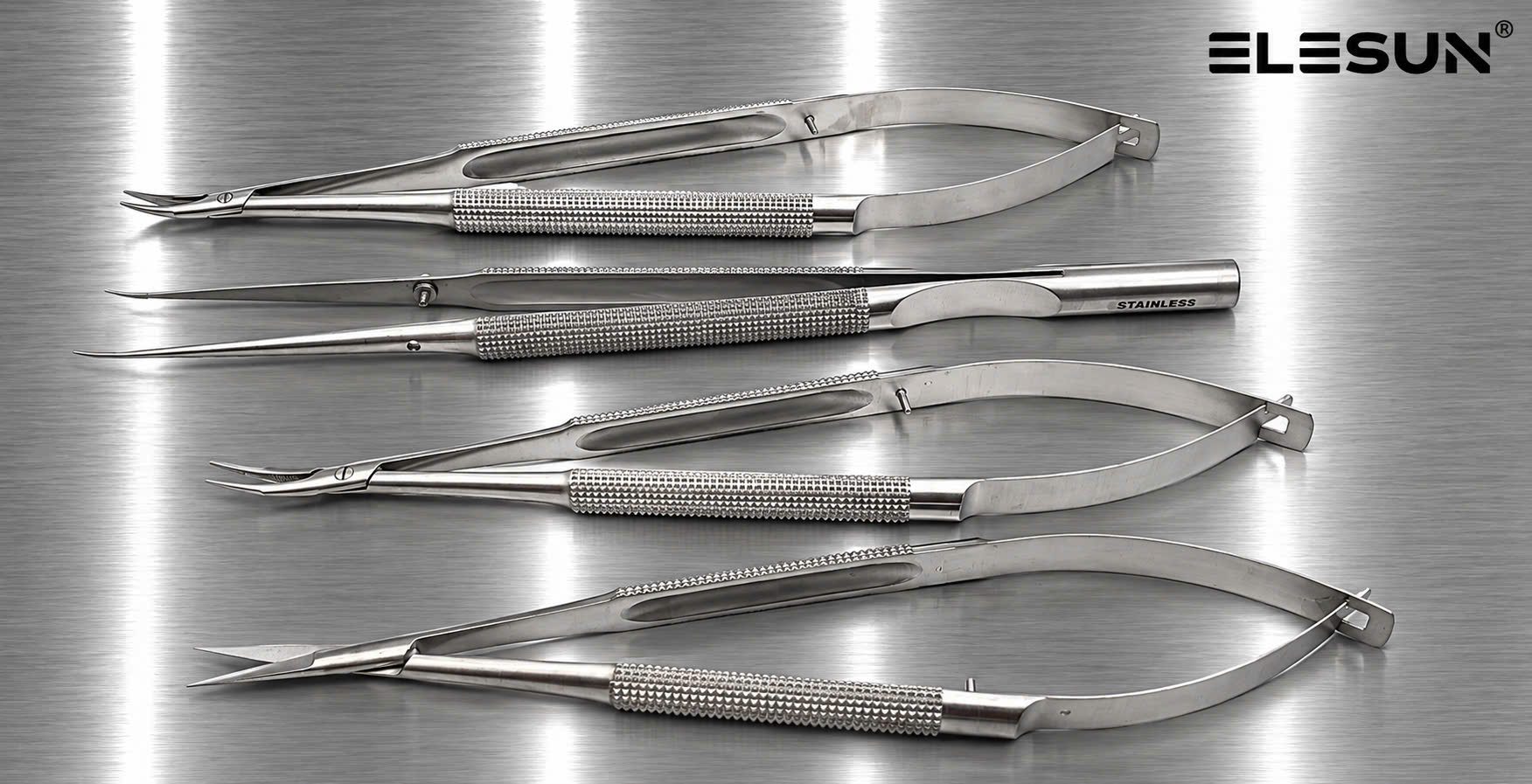Four ELESUN spring-handle microsurgical instruments with round knurled handles and straight or curved working ends